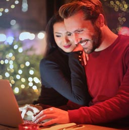 A photo of a couple in an international dating setup.